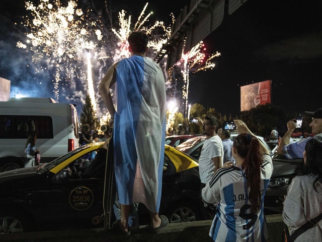 Soccer fans watch fireworks welcoming home the players from Qatar. AP Photo/Rodrigo Abd