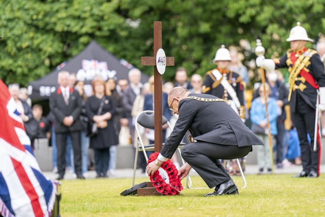 Lord Provost of the City of Edinburgh Robert Aldridge lays a wreath during a service of remembrance in Edinburgh to commemorate the 40th anniversary of the end of the Falklands conflict.