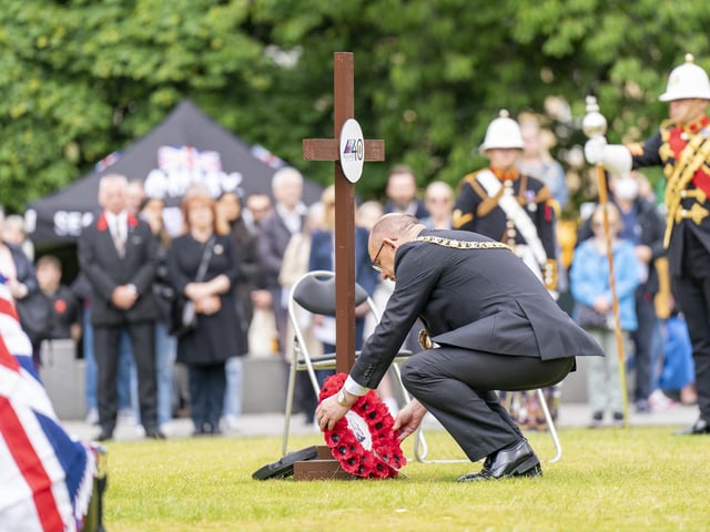 Lord Provost of the City of Edinburgh Robert Aldridge lays a wreath during a service of remembrance in Edinburgh to commemorate the 40th anniversary of the end of the Falklands conflict.