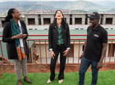 Home Secretary Suella Braverman laughs as she tours a building site on the outskirts of Kigali, Rwanda, where deported migrants are planned to be housed (Picture: Stefan Rousseau/PA)