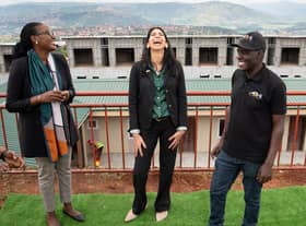 Home Secretary Suella Braverman laughs as she tours a building site on the outskirts of Kigali, Rwanda, where deported migrants are planned to be housed (Picture: Stefan Rousseau/PA)