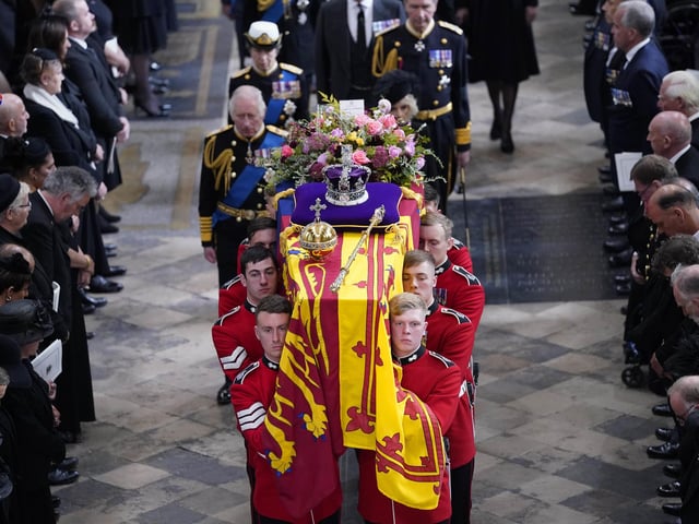 King Charles III, the Queen Consort, the Princess Royal and Vice Admiral Sir Tim Laurence follow behind the coffin of Queen Elizabeth II, draped in the Royal Standard with the Imperial State Crown and the Sovereign's orb and sceptre, as it is carried out of Westminster Abbey after her State Funeral. Picture date: Monday September 19, 2022.