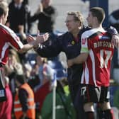 Nick Montgomery and Neil Warnock celebrate during a Sheffield United match back in 2006.