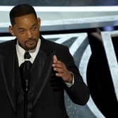 Will Smith cries as he accepts the award for best performance by an actor in a leading role for "King Richard" at the Oscars on Sunday, March 27, 2022. (Image credit: AP Photo/Chris Pizzello)