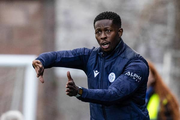 Marvin Bartley gives instructions during Queen of the South's Viaplay Cup match against Motherwell.