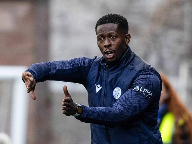 Marvin Bartley gives instructions during Queen of the South's Viaplay Cup match against Motherwell.