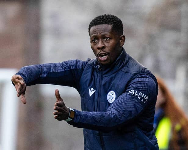 Marvin Bartley gives instructions during Queen of the South's Viaplay Cup match against Motherwell.