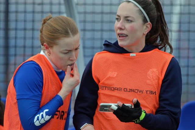 Sarah Jamieson (left) and Great Britain defender, Amy Costello, look at tactics