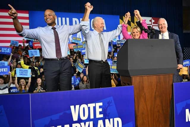 Gubernatorial candidate Wes Moore, US President Joe Biden, US First Lady Jill Biden and US Senator Chris Van Hollen acknowledge the crowd during a rally on the eve of the US midterm elections, at Bowie State University in Bowie, Maryland.