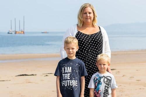 Laura Gallagher with her sons Nathan (left) and Jamie at Thorntonloch. (Photo: Nick Mailer)