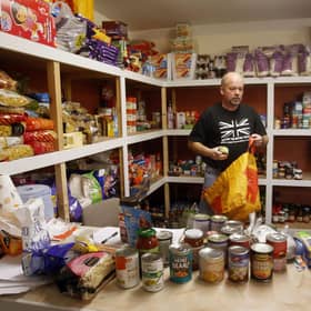 Volunteer William Forey at Drumchapel food bank near Glasgow.