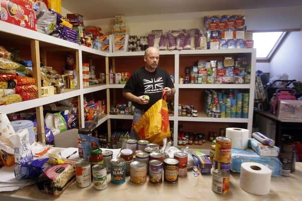 Volunteer William Forey at Drumchapel food bank near Glasgow.