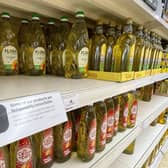 Here, cooking oil is limited on shelves in a Sainsbury's store in Kent. Photo: Gareth Fuller/PA Wire