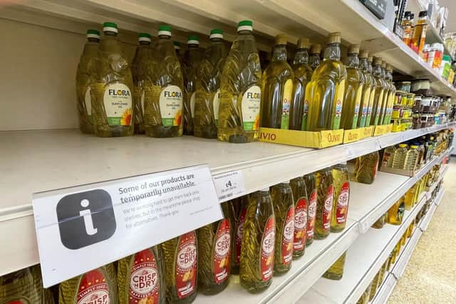 Here, cooking oil is limited on shelves in a Sainsbury's store in Kent. Photo: Gareth Fuller/PA Wire