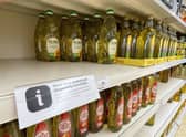 Here, cooking oil is limited on shelves in a Sainsbury's store in Kent. Photo: Gareth Fuller/PA Wire
