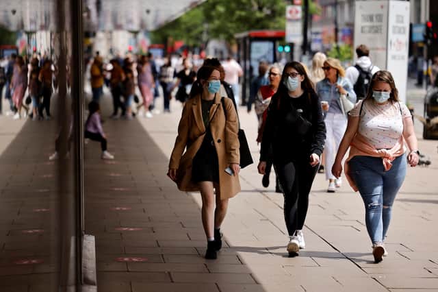 Pedestrians wearing a face mask or covering. Picture: Tolga Akmen via Getty Images
