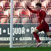 Ben Doak celebrates as he scores for Liverpool to make it 4-3 during a UEFA Youth League match between Rangers and Liverpool at Firhill.
