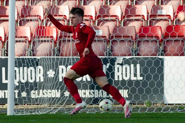 Ben Doak celebrates as he scores for Liverpool to make it 4-3 during a UEFA Youth League match between Rangers and Liverpool at Firhill.