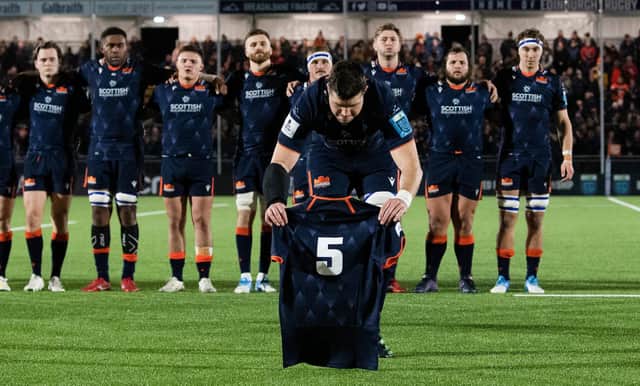 Edinburgh Captain Grant Gilchrist lays the No 5 jersey after the passing of Doddie Weir ahead of the kick-off against Munster.