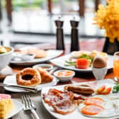 Setting of breakfast dishes in hotel restaurant Pic: Adobe