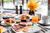 Setting of breakfast dishes in hotel restaurant Pic: Adobe