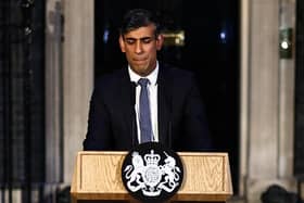 Prime Minister Rishi Sunak makes a statement outside 10 Downing Street (Photo by HENRY NICHOLLS/AFP via Getty Images)
