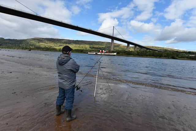 Waverley passes under the Erskine Bridge en route to her home in Glasgow today. Picture: John Devlin