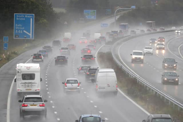 Persistent downpours are expected to bring flooding and transport disruption, with more than 20 flood alerts in place.