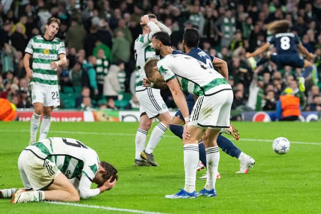 Celtic players fall to the floor dejected after Lazio's Pedro scores an injury-time winner. (Photo by Paul Devlin / SNS Group)