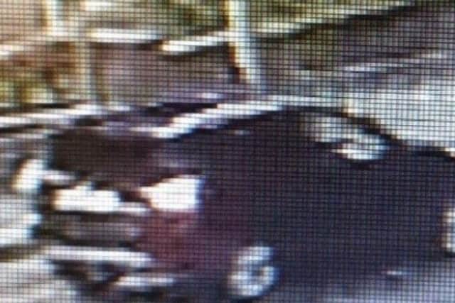 An image released by Police Scotland of the dark-coloured car which drove away from Arbroath Police Station after the Mr Watson's phone was dropped off.