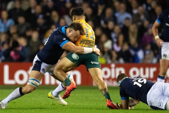 Jack Dempsey tackles Hunter Paisami at BT Murrayfield. (Photo by Ross Parker / SNS Group)