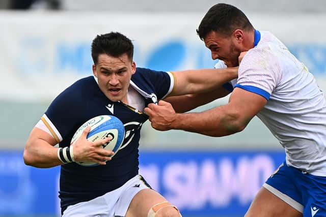 Scotland centre Sam Johnson holds off Italy tighthead prop Giosue Zilocchi during the Nations Cup win in Florence.