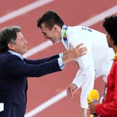 Jake Wightman is presented with his gold medal by World Athletics President Sebastian Coe. (Photo by Andy Lyons/Getty Images for World Athletics)