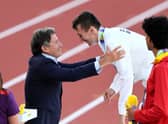 Jake Wightman is presented with his gold medal by World Athletics President Sebastian Coe. (Photo by Andy Lyons/Getty Images for World Athletics)