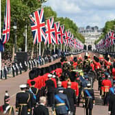 The Queen’s funeral cortege makes its way along The Mall from Buckingham Palace  during the procession for the Lying-in State of Queen Elizabeth II on September 14, 2022.