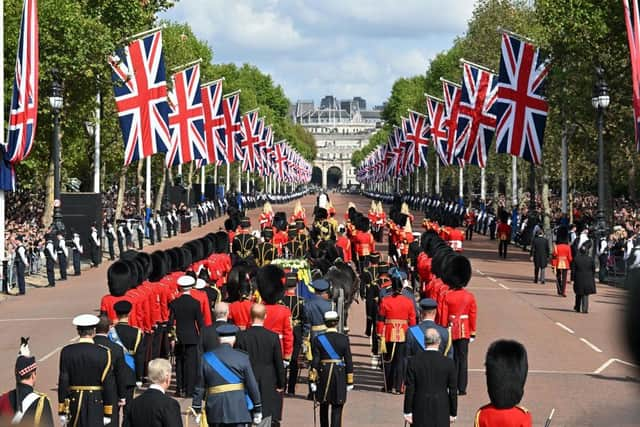 The Queen’s funeral cortege makes its way along The Mall from Buckingham Palace  during the procession for the Lying-in State of Queen Elizabeth II on September 14, 2022.