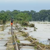 A boy walks on a damaged railway track in Sunamganj, Bangladesh, where climate change has increased the frequency of floods (Picture: Mamun Hossain/AFP via Getty Images)