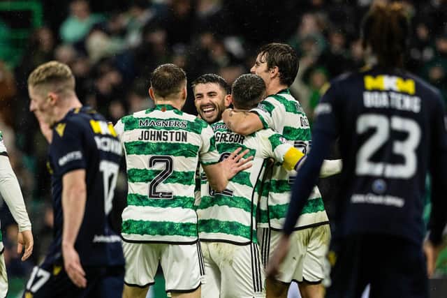 Celtic's Callum McGregor celebrates with teammates after scoring to make it 6-0 over Dundee in first-half stoppage time. (Photo by Craig Foy / SNS Group)