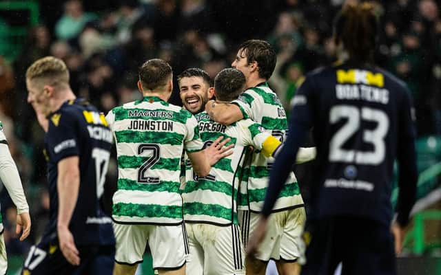 Celtic's Callum McGregor celebrates with teammates after scoring to make it 6-0 over Dundee in first-half stoppage time. (Photo by Craig Foy / SNS Group)