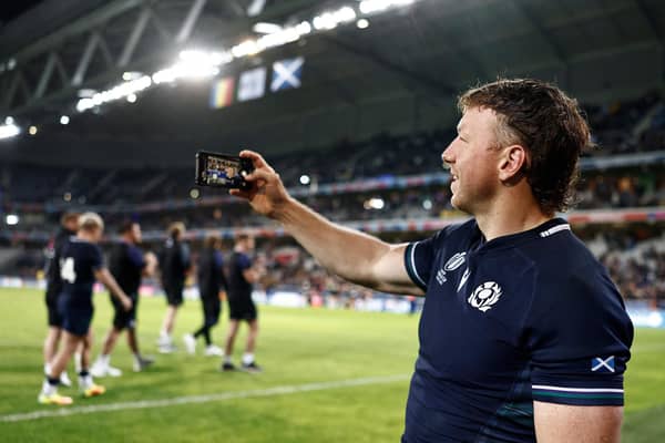 Scotland's flanker Hamish Watson takes a selfie with supporters after Scotland defeated Romania.