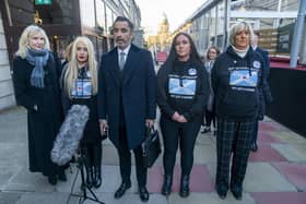 Solicitor Aamer Anwar with Caroleanne Stewart (left) and Pamela Thomas (right) and relatives of the bereaved from the Scottish Covid Bereaved group. Picture: Jane Barlow/PA Wire