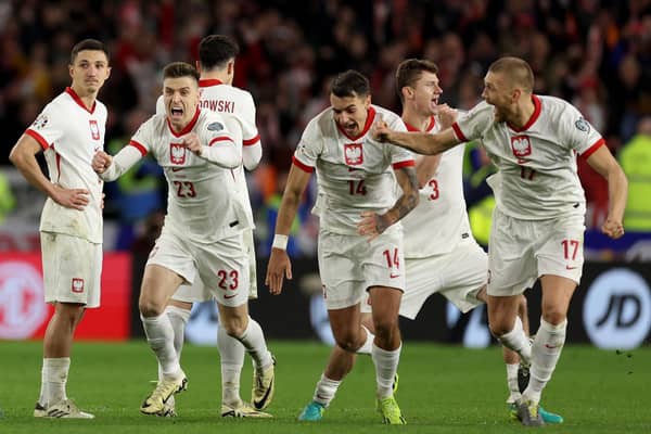 Poland celebrate after victory in the penalty shoot out over Wales in the Euro 2024 play-off final in Cardiff. (Photo by Richard Heathcote/Getty Images)