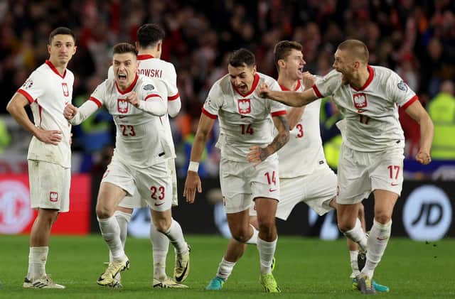 Poland celebrate after victory in the penalty shoot out over Wales in the Euro 2024 play-off final in Cardiff. (Photo by Richard Heathcote/Getty Images)