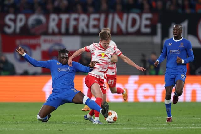Calvin Bassey, pictured challenging Dani Olmo, defended superbly for Rangers in the first leg of the Europa League semi-final against RB Leipzig in Germany. (Photo by Maja Hitij/Getty Images)