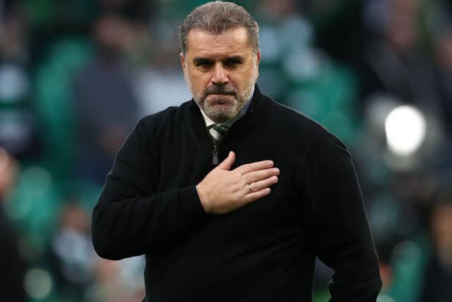 Celtic manager Ange Postecoglou holds his hand over the Celtic crest on his jumper in acknowledgement of the Celtic support following the win over Ferencvaros.  (Photo by Alan Harvey / SNS Group)