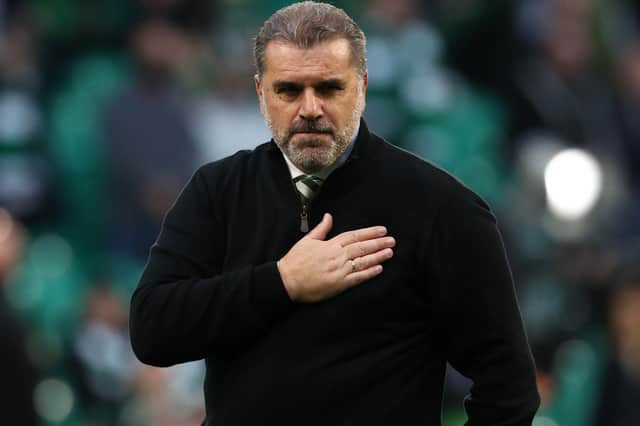 Celtic manager Ange Postecoglou holds his hand over the Celtic crest on his jumper in acknowledgement of the Celtic support following the win over Ferencvaros.  (Photo by Alan Harvey / SNS Group)