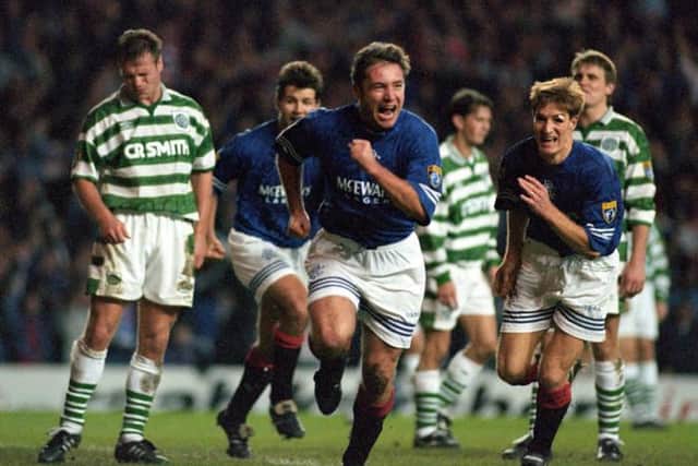 Ally McCoist celebrates scoring Rangers' second goal in the epic 3-3 draw against Celtic at Ibrox on November 19, 1995.