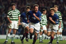 Ally McCoist celebrates scoring Rangers' second goal in the epic 3-3 draw against Celtic at Ibrox on November 19, 1995.