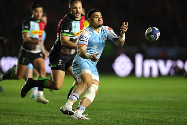 Glasgow Warriors' Sione Tuipulotu passes the ball on his comeback for the team.