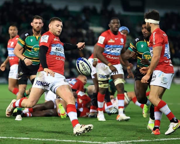 Finn Russell of Racing 92 kicks the ball upfield during the Heineken Champions Cup win over Northampton Saints (Photo by David Rogers/Getty Images)